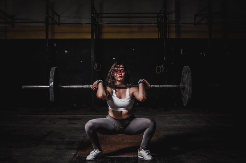 Girl lifting a barbell with barbell neck pad: PC- https://www.pexels.com/photo/woman-lifting-barbell-1552249/
